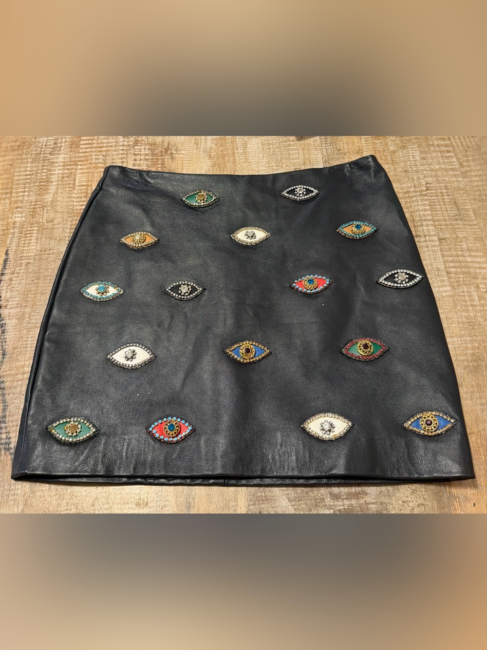 Nicole Miller “evil eye”  black leather mini skirt size 2. NWT